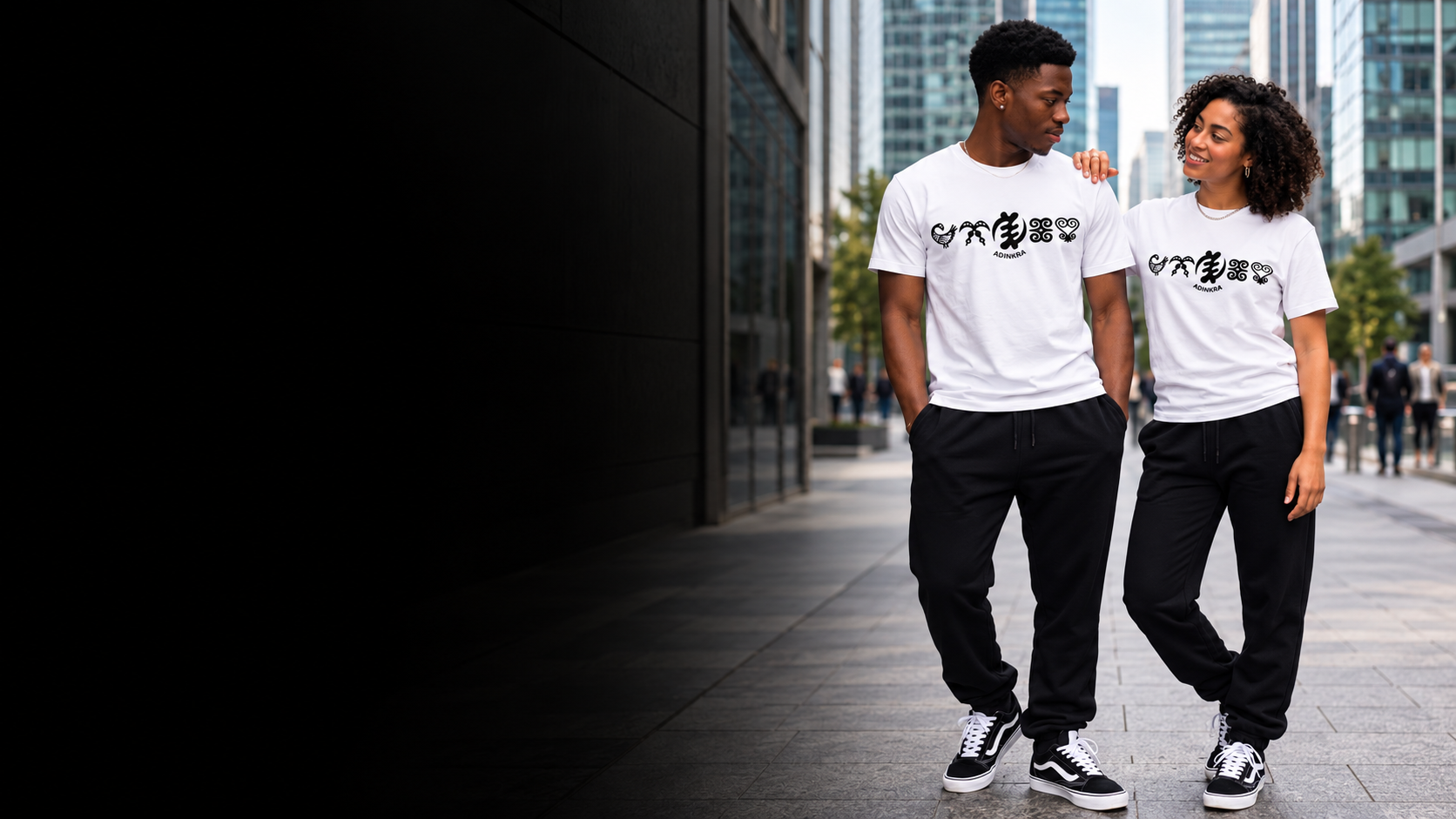 Couple wearing white Adinkra T-shirts